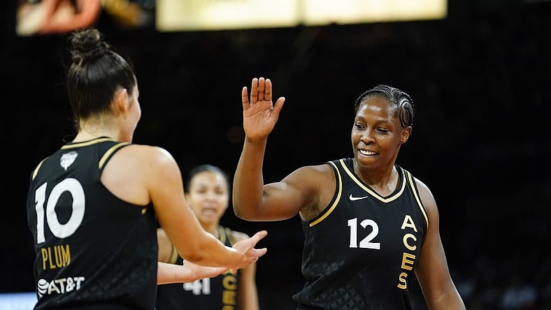 Sep 13, 2022; Las Vegas, Nevada, USA; Las Vegas Aces guard Chelsea Gray (12) celebrates with guard Kelsey Plum (10) during the fourth quarter in game two of the 2022 WNBA Finals against the Connecticut Sun at Michelob Ultra Arena. Mandatory Credit: Lucas Peltier-USA TODAY Sports