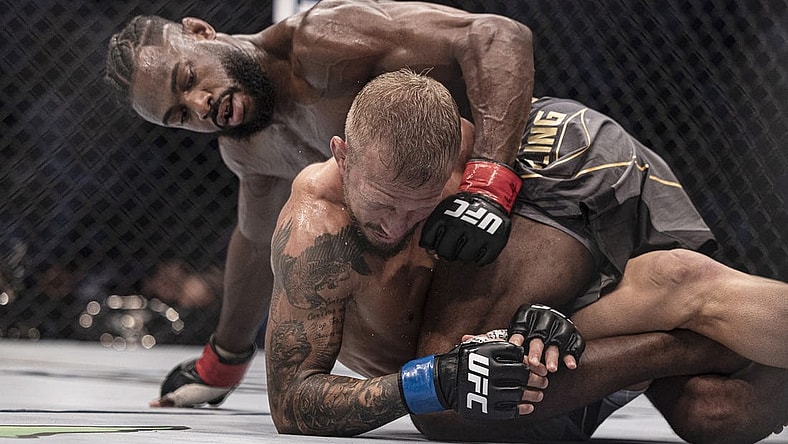 Oct 22, 2022; Abu Dhabi, UAE; Aljamain Sterling (red gloves) and T.J. Dillashaw (blue gloves) during UFC 280 at Etihad Arena. Mandatory Credit: Craig Kidwell-USA TODAY Sports