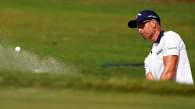 Oct 29, 2022; Miami, Florida, USA; Henrik Stenson plays his shot out of the 17th green side bunker during the second round of the season finale of the LIV Golf series at Trump National Doral. Mandatory Credit: John David Mercer-USA TODAY Sports
