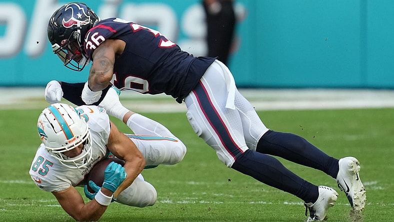 Miami Dolphins wide receiver River Cracraft (85) hauls in a catch as Houston Texans safety Jonathan Owens (36) closes in for the tackle during the first half of an NFL game at Hard Rock Stadium in Miami Gardens, Nov. 27, 2022.