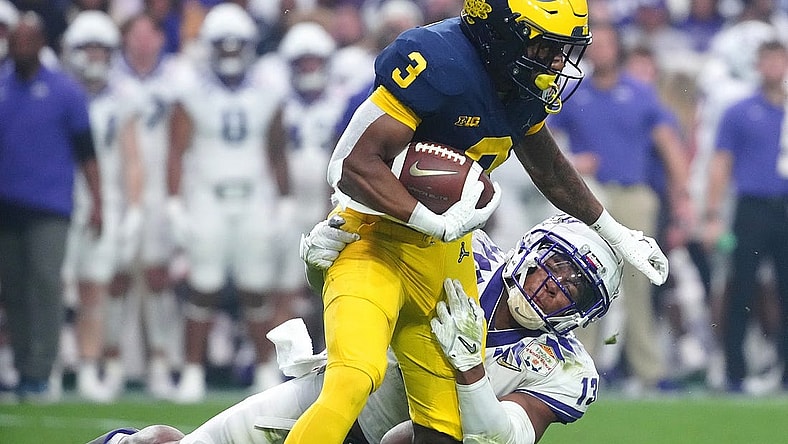 December 31, 2022; Glendale, Ariz; USA; TCU linebacker Dee Winters (13) tackles Michigan wide receiver AJ Henning (3) during the second half at State Farm Stadium. Mandatory Credit: Patrick Breen-Arizona Republic

Ncaa Fiesta Bowl Game