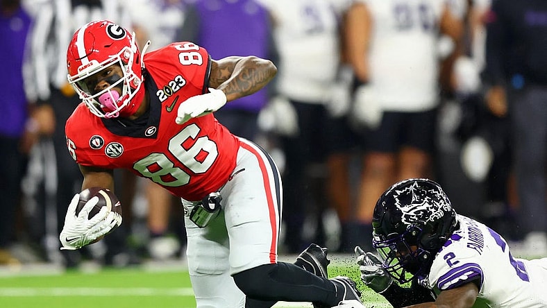 Jan 9, 2023; Inglewood, CA, USA; Georgia Bulldogs quarterback Collin Drake (26) runs with the ball against TCU Horned Frogs cornerback Kee'Yon Stewart (2) during the third quarter of the CFP national championship game at SoFi Stadium. Mandatory Credit: Mark J. Rebilas-USA TODAY Sports