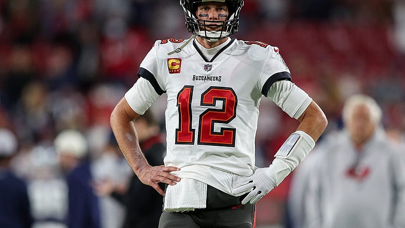 Jan 16, 2023; Tampa, Florida, USA; Tampa Bay Buccaneers quarterback Tom Brady (12) looks on before a  wild card game against the Dallas Cowboys at Raymond James Stadium. Mandatory Credit: Nathan Ray Seebeck-USA TODAY Sports