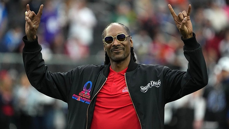 Feb 5, 2023; Paradise, Nevada, USA; AFC captain and recording artist Snoop Dogg watches from the sidelines against the NFC during the Pro Bowl Games at Allegiant Stadium. Mandatory Credit: Kirby Lee-USA TODAY Sports