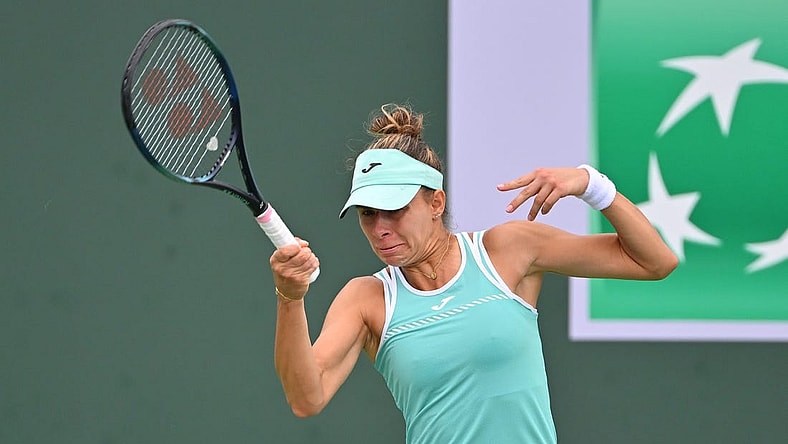 Mar 11, 2023; Indian Wells, CA, USA;  Magda Linette (POL)  hits a shot in her second round match against Emma Raducanu (GBR) in the BNP Paribas Open at the Indian Wells Tennis Garden. Mandatory Credit: Jayne Kamin-Oncea-USA TODAY Sports