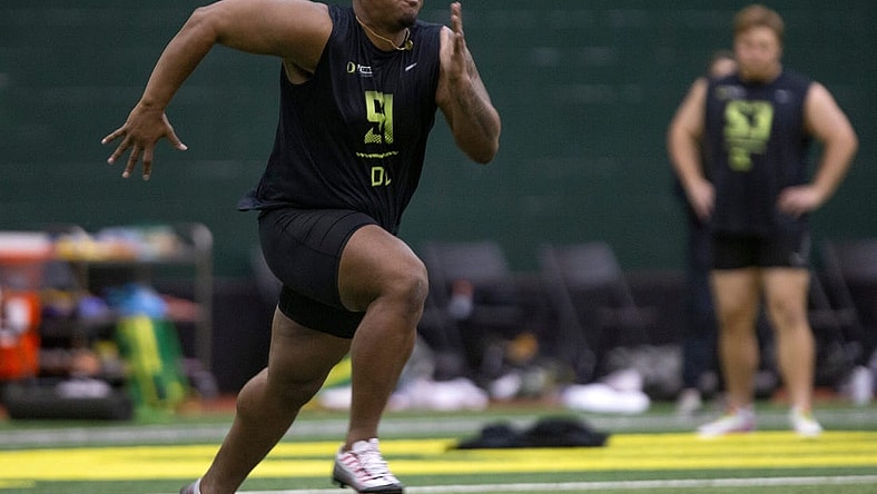 Defensive lineman Jordon Riley runs during Oregon Pro Day at the Moshofsky Center Tuesday March 14, 2023.

Eug 031423 Pro Day 03