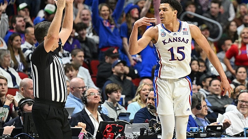 Mar 18, 2023; Des Moines, IA, USA; Kansas Jayhawks guard Kevin McCullar Jr. (15) reacts after a basket against the Arkansas Razorbacks during the second half at Wells Fargo Arena. Mandatory Credit: Jeffrey Becker-USA TODAY Sports