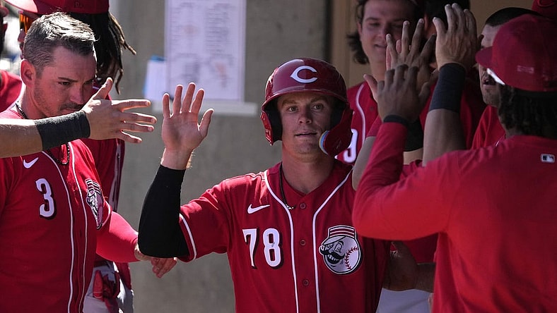 Mar 26, 2023; Salt River Pima-Maricopa, Arizona, USA; Cincinnati Reds second baseman Matt McLain (78) celebrates with teammates after scoring a run against the Colorado Rockies in the third inning at Salt River Fields at Talking Stick. Mandatory Credit: Rick Scuteri-USA TODAY Sports