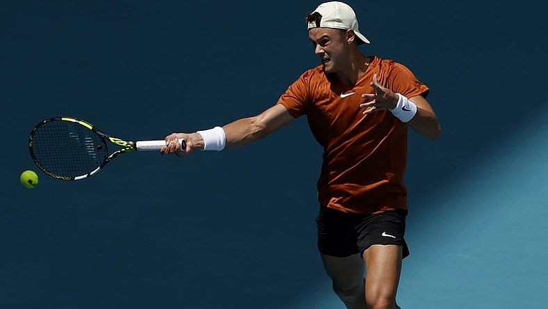 Mar 28, 2023; Miami, Florida, US; Holger Rune (DEN) hits a forehand against Taylor Fritz (USA) (not pictured) on day nine of the Miami Open at Hard Rock  Stadium. Mandatory Credit: Geoff Burke-USA TODAY Sports