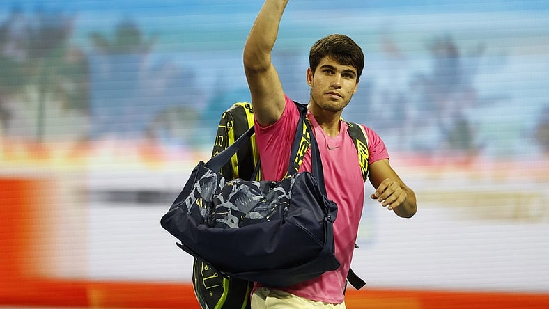 Mar 31, 2023; Miami, Florida, US; Carlos Alcaraz (ESP) waves to the crowd while leaving the court after his match against Jannik Sinner (ITA) (not pictured) in a men's singles semifinal on day twelve on the Miami Open at Hard Rock Stadium. Mandatory Credit: Geoff Burke-USA TODAY Sports