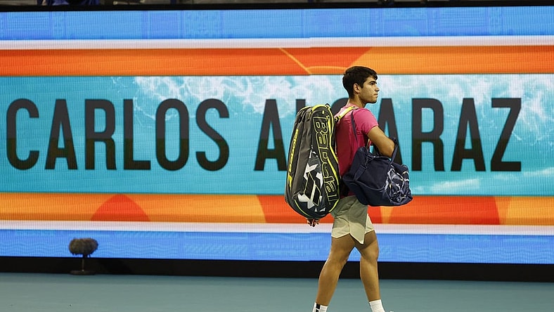 Mar 31, 2023; Miami, Florida, US; Carlos Alcaraz (ESP) waves to the crowd while leaving the court after his match against Jannik Sinner (ITA) (not pictured) in a men's singles semifinal on day twelve on the Miami Open at Hard Rock Stadium. Mandatory Credit: Geoff Burke-USA TODAY Sports