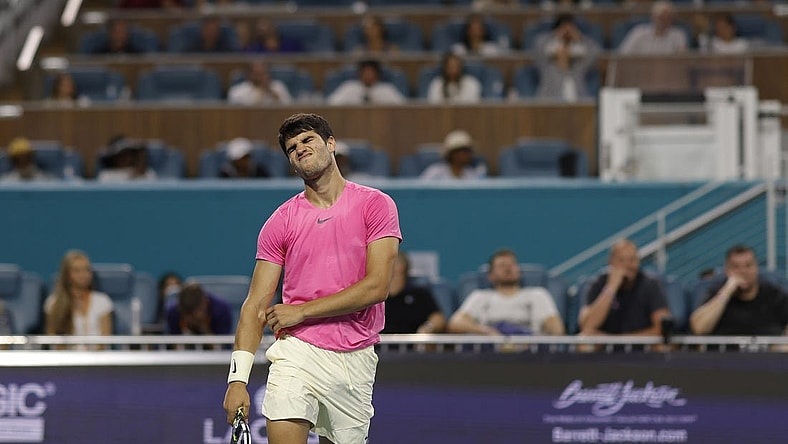 Mar 31, 2023; Miami, Florida, US; Carlos Alcaraz (ESP) reacts after missing a shot against Jannik Sinner (ITA) (not pictured) in a men's singles semifinal on day twelve on the Miami Open at Hard Rock Stadium. Mandatory Credit: Geoff Burke-USA TODAY Sports