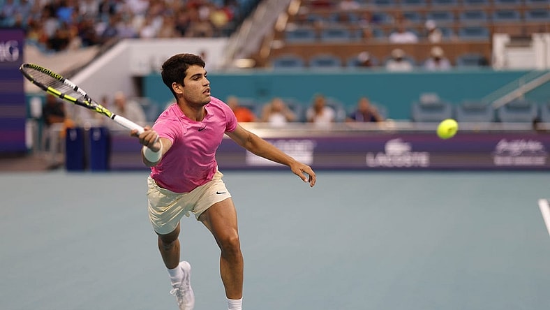 Mar 31, 2023; Miami, Florida, US; Carlos Alcaraz (ESP) reaches for a forehand against Jannik Sinner (ITA) (not pictured) in a men's singles semifinal on day twelve on the Miami Open at Hard Rock Stadium. Mandatory Credit: Geoff Burke-USA TODAY Sports