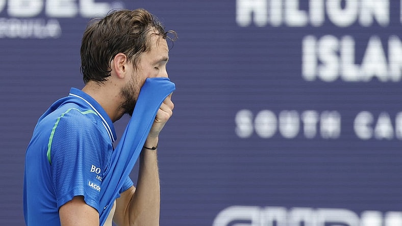 Apr 2, 2023; Miami, Florida, US; Daniil Medvedev wipes his face between points against Jannik Sinner (ITA) (not pictured) in the men's singles final on day fourteen of the Miami Open at Hard Rock Stadium. Mandatory Credit: Geoff Burke-USA TODAY Sports