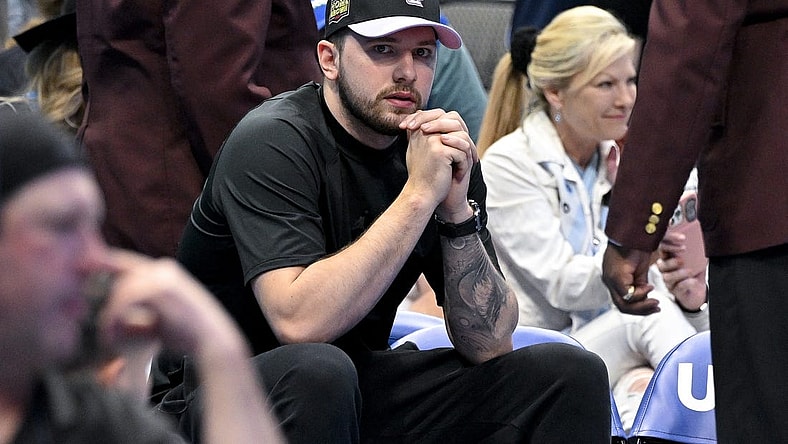 Apr 9, 2023; Dallas, Texas, USA; Dallas Mavericks guard Luka Doncic (77) sits by himself during a timeout in the game between the Dallas Mavericks and the San Antonio Spurs at the American Airlines Center. Mandatory Credit: Jerome Miron-USA TODAY Sports