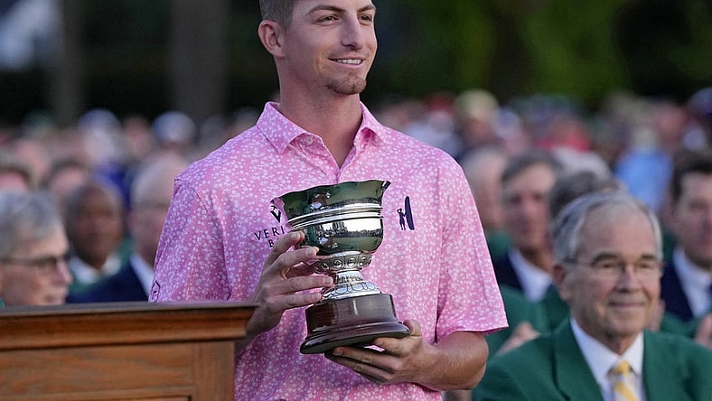 Apr 9, 2023; Augusta, Georgia, USA; Sam Bennett holds the low amateur trophy after the final round of The Masters golf tournament. Mandatory Credit: Michael Madrid-USA TODAY Network