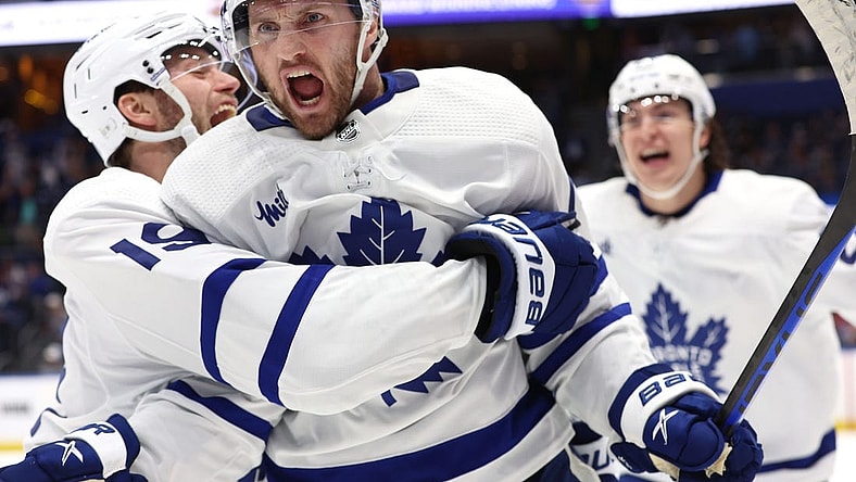 Apr 24, 2023; Tampa, Florida, USA;Toronto Maple Leafs center Alexander Kerfoot (15) celebrates after he scored the game-winning goal against the Tampa Bay Lightning in overtime of game four of the first round of the 2023 Stanley Cup Playoffs at Amalie Arena. Mandatory Credit: Kim Klement-USA TODAY Sports