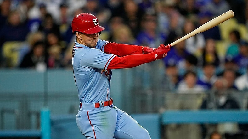 Apr 29, 2023; Los Angeles, California, USA; St. Louis Cardinals shortstop Tommy Edman (19) hits a single against the Los Angeles Dodgers during the sixth inning at Dodger Stadium. Mandatory Credit: Lucas Peltier-USA TODAY Sports