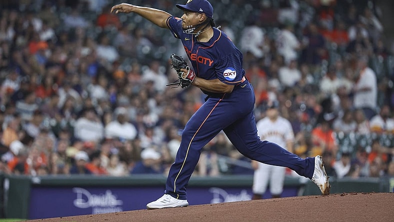 May 1, 2023; Houston, Texas, USA; Houston Astros starting pitcher Luis Garcia (77) delivers a pitch during the first inning aSan Francisco Giants at Minute Maid Park. Mandatory Credit: Troy Taormina-USA TODAY Sports
