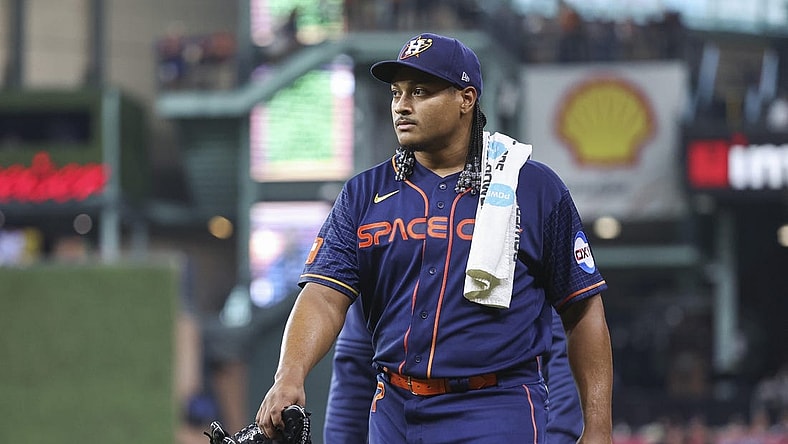 May 1, 2023; Houston, Texas, USA; Houston Astros starting pitcher Luis Garcia (77) walks to the dugout before the game against the San Francisco Giants at Minute Maid Park. Mandatory Credit: Troy Taormina-USA TODAY Sports