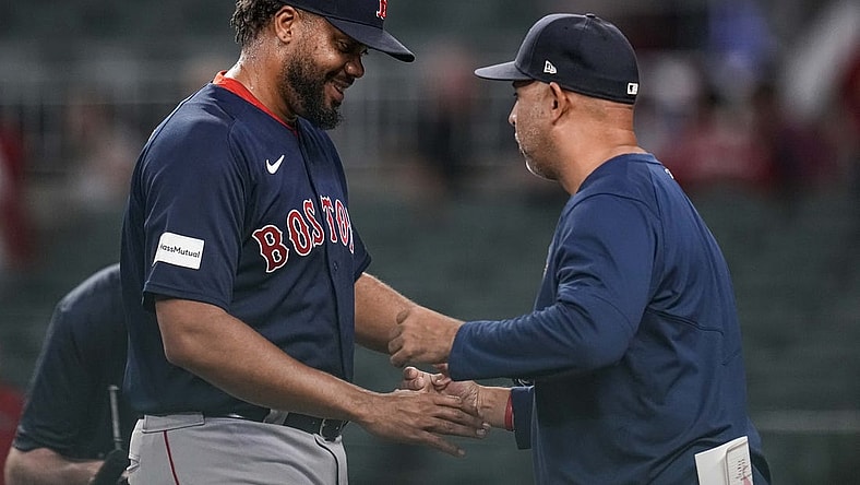 May 10, 2023; Cumberland, Georgia, USA; Boston Red Sox relief pitcher Kenley Jansen (74) reacts with manager Alex Cora (13) after recording his 400th career save against the Atlanta Braves at Truist Park. Mandatory Credit: Dale Zanine-USA TODAY Sports