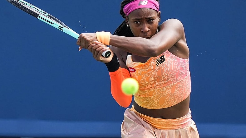 Coco Gauff returns the ball to Marle Bouzkova during their match on the Grand Stand court at the 2022 Western & Southern Open on Tuesday August 16. Gauff forfeit during the second set after receiving an injury.