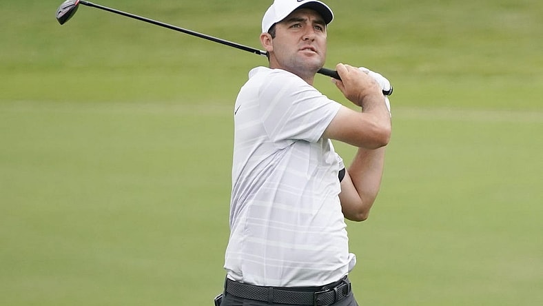 May 12, 2023; McKinney, Texas, USA; Scottie Scheffler watches shot on the 18th hole during the second round of the AT&T Byron Nelson golf tournament. Mandatory Credit: Raymond Carlin III-USA TODAY Sports