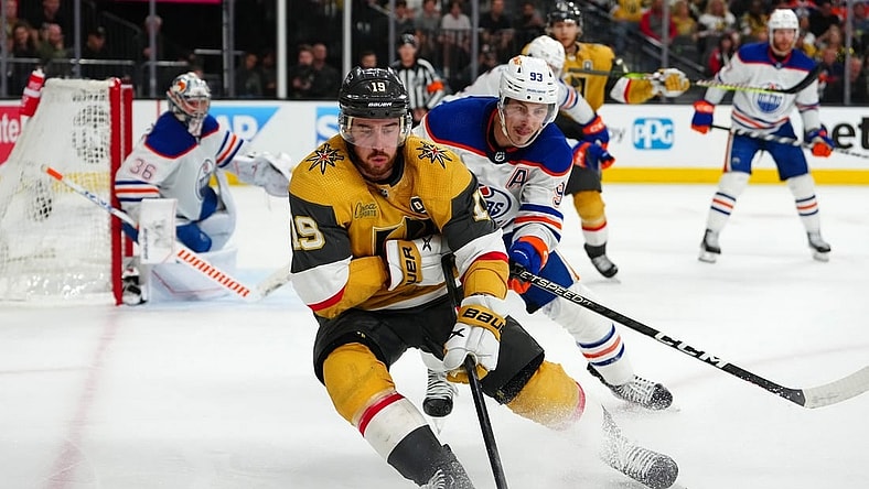 May 12, 2023; Las Vegas, Nevada, USA; Vegas Golden Knights right wing Reilly Smith (19) skates ahead of Edmonton Oilers center Ryan Nugent-Hopkins (93) during the third period of game five of the second round of the 2023 Stanley Cup Playoffs at T-Mobile Arena. Mandatory Credit: Stephen R. Sylvanie-USA TODAY Sports