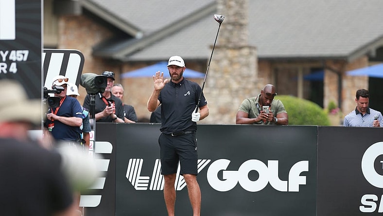 May 14, 2023; Tulsa, Oklahoma, USA; Dustin Johnson waves to the crowd on the opening tee during the final round of a LIV Golf event at Cedar Ridge Country Club. Mandatory Credit: Joey Johnson-USA TODAY Sports
