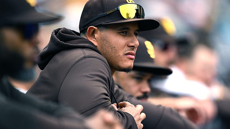 May 17, 2023; San Diego, California, USA; San Diego Padres third baseman Manny Machado (13) looks on from the dugout during the eighth inning against the Kansas City Royals at Petco Park. Mandatory Credit: Orlando Ramirez-USA TODAY Sports