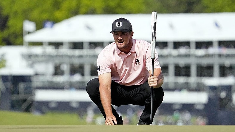 May 18, 2023; Rochester, New York, USA; Bryson DeChambeau lines up a putt on the ninth green during the first round of the PGA Championship golf tournament at Oak Hill Country Club. Mandatory Credit: Adam Cairns-USA TODAY Sports
