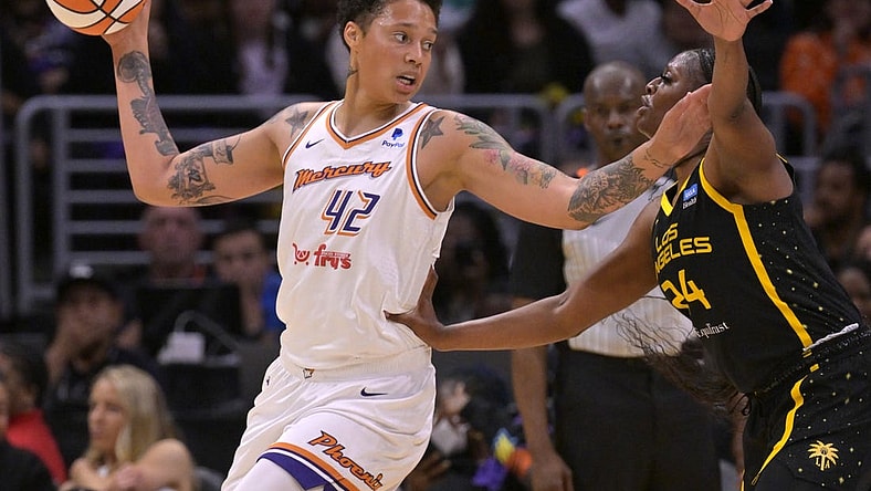 May 19, 2023; Los Angeles, California, USA;  Phoenix Mercury center Brittney Griner (42) is defended by Los Angeles Sparks forward Joyner Holmes (24) in the first half at Crypto.com Arena. Mandatory Credit: Jayne Kamin-Oncea-USA TODAY Sports