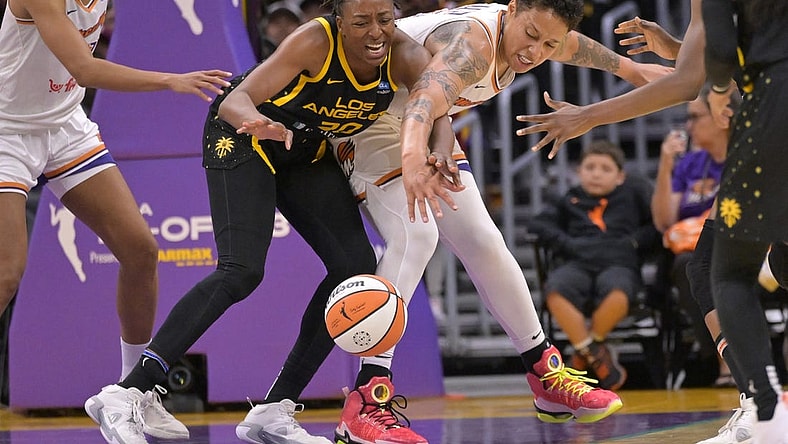 May 19, 2023; Los Angeles, California, USA;  Los Angeles Sparks forward Nneka Ogwumike (30) and Phoenix Mercury center Brittney Griner (42) reach for a loose ball in the second half at Crypto.com Arena. Mandatory Credit: Jayne Kamin-Oncea-USA TODAY Sports
