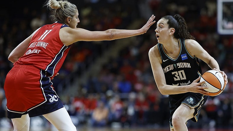 May 19, 2023; Washington, District of Columbia, USA; New York Liberty forward Breanna Stewart (30) holds the ball as Washington Mystics forward Elena Delle Donne (11) defends at Entertainment & Sports Arena. Mandatory Credit: Geoff Burke-USA TODAY Sports