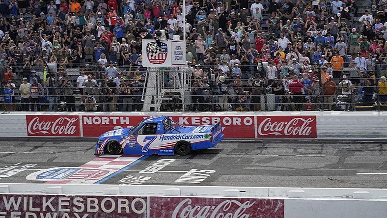 May 20, 2023; North Wilkesboro, North Carolina, USA;  NASCAR Craftsman Truck Series driver Kyle Larson (7) crosses the finish line during the Tyson 250 at North Wilkesboro Speedway. Mandatory Credit: Jim Dedmon-USA TODAY Sports