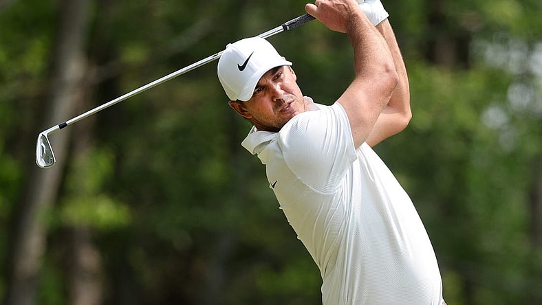 Brooks Koepka hits his tee shot on the third hole at the 2023 PGA Championship.
