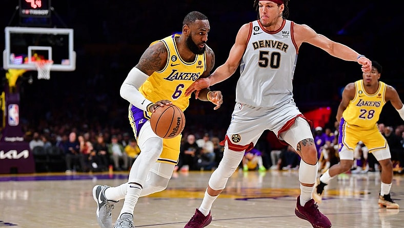 May 22, 2023; Los Angeles, California, USA; Los Angeles Lakers forward LeBron James (6) drives to the basket against Denver Nuggets forward Aaron Gordon (50) during the third quarter in game four of the Western Conference Finals for the 2023 NBA playoffs at Crypto.com Arena. Mandatory Credit: Gary A. Vasquez-USA TODAY Sports