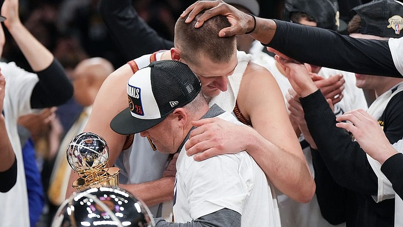 May 22, 2023; Los Angeles, California, USA; Denver Nuggets center Nikola Jokic (15) and head coach Michael Malone celebrate beating the Los Angeles Lakers in game four of the Western Conference Finals for the 2023 NBA playoffs at Crypto.com Arena. Mandatory Credit: Kirby Lee-USA TODAY Sports