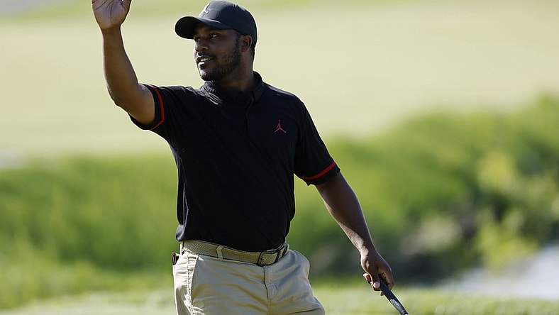 May 25, 2023; Washington, DC, USA; Harold Varner III waves to the crowd after making a birdie putt on the eighteenth hole during the first round of the LIV Golf DC 2023 tournament at Trump National Golf Club in Sterling, Va. Mandatory Credit: Geoff Burke-USA TODAY Sports