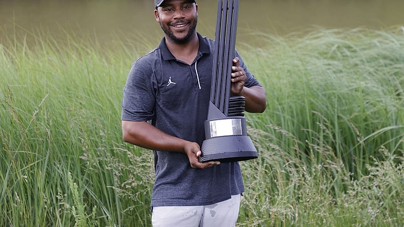 May 28, 2023; Potomac Falls, Virginia, USA; Harold Varner III poses with the champions trophy after winning the individual championship of LIV Golf Washington, D.C. golf tournament at Trump National. Mandatory Credit: Geoff Burke-USA TODAY Sports