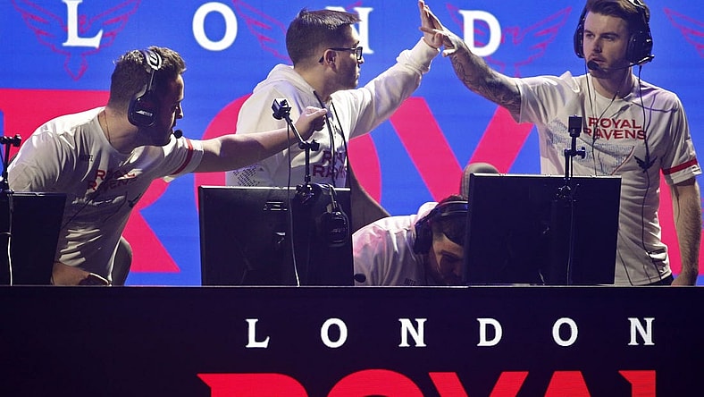 Jan 25, 2020; Minneapolis, Minnesota, USA; Matthew Skrapz Marshall and Dylan Henderson and Rhys Rated Price of the London Royal Ravens celebrate after defeating the New York Subliners during the Call of Duty League Launch Weekend at The Armory. Mandatory Credit: Bruce Kluckhohn-USA TODAY Sports