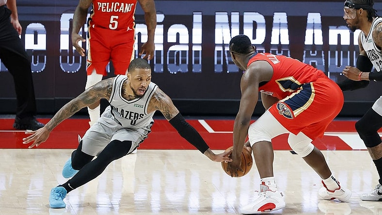 Trade chatter before Thursday's NBA draft connects Portland Trail Blazers point guard Damian Lillard (left) with New Orleans Pelicans power forward Zion Williamson. Mandatory Credit: Soobum Im-USA TODAY Sports