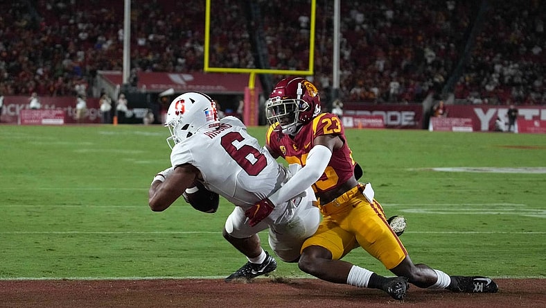 Sep 11, 2021; Los Angeles, California, USA; Stanford Cardinal wide receiver Elijah Higgins (6) catches a 3-yard touchdown pass as Southern California Trojans cornerback Joshua Jackson Jr. (23) defends in the second quarter  at United Airlines Field at Los Angeles Memorial Coliseum. Mandatory Credit: Kirby Lee-USA TODAY Sports
