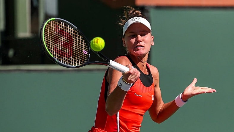 Veronika Kudermetova of Russia returns the ball while playing with doubles partner Elena Rybakina of Kazakhstan against Su-Wei Hsieh of Taiwan and Elise Mertens of Belgium during the women's doubles final of the BNP Paribas Open at the Indian Wells Tennis Garden, Saturday, Oct. 16, 2021, in Indian Wells, Calif.