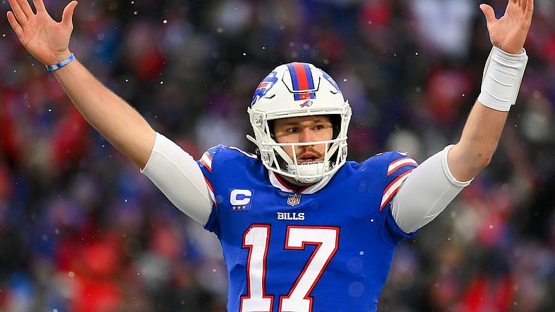 Jan 2, 2022; Orchard Park, New York, USA; Buffalo Bills quarterback Josh Allen (17) reacts to a touchdown against the Atlanta Falcons during the second half at Highmark Stadium. Mandatory Credit: Rich Barnes-USA TODAY Sports