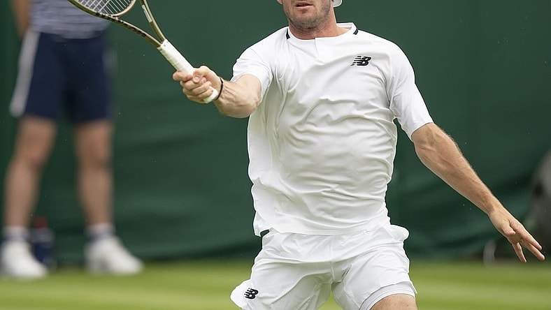 Jun 27, 2022; London, United Kingdom;  Tommy Paul (USA) returns a shot during his first round match against Fernando Verdasco (ESP) on day one at All England Lawn Tennis and Croquet Club. Mandatory Credit: Susan Mullane-USA TODAY Sports