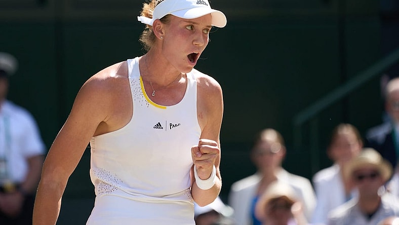 Jul 9, 2022; London, England, United Kingdom;  Elena Rybakina (KAZ)  celebrates on her way to winning her women   s singles final against Ons Jabeur (TUN) on Centre court at All England Lawn Tennis and Croquet Club. Mandatory Credit: Peter van den Berg-USA TODAY Sports