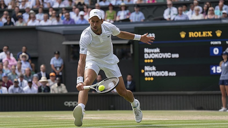 Jul 10, 2022; London, United Kingdom; Novak Djokovic (SRB) returns a shot during the men   s final against Nick Kyrgios (not pictured) on day 14 at All England Lawn Tennis and Croquet Club. Mandatory Credit: Susan Mullane-USA TODAY Sports