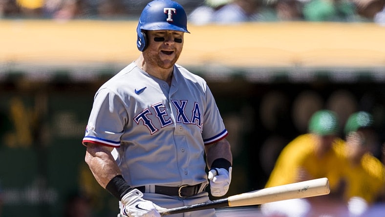 Jul 24, 2022; Oakland, California, USA;  Texas Rangers left fielder Kole Calhoun (56) reacts after a called third strike during the sixth inning of the game against the Oakland Athletics at RingCentral Coliseum. Mandatory Credit: John Hefti-USA TODAY Sports