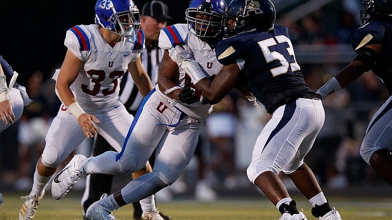 Dion Stutts (62) of MUS and Tre Jones (53) of Arlington  during the game between the Arlington Tigers and MUS Owls on Friday August, 19th 2022 in Arlington, Tn (Justin Ford/Special to the Commercial Appeal)

Arlingtonvsmus0020